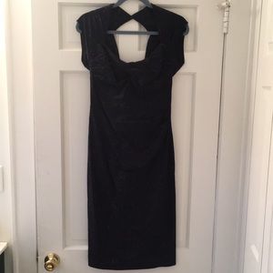 Vintage inspired blue dress with red polka dots. Keyhole back with large bow.